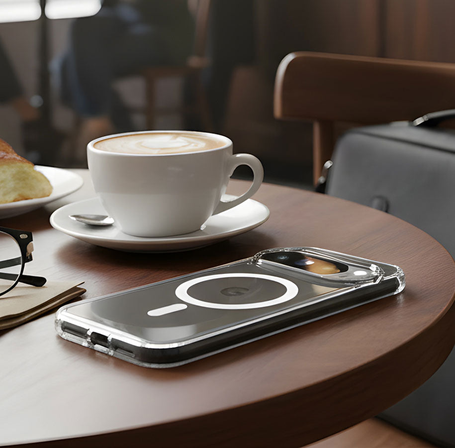 A person holds up an iPhone 17 in an EvoClear MagSafe case by Tech21 as if to take a picture